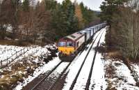 66120 hauls the Stobart Rail containers through the loop at Moy on 7 February. Just behind the tall tree on the right is one of the cut back platforms of Moy Station. (Closed 1965)<br>
<br><br>[John Gray 07/02/2011]