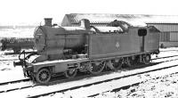 Nearing the end of its life, one of the large A8 4-6-2 tank locomotives, no 69887, (rebuilt from an original NER 4-4-4T) stands in the snow alongside the breakdown crane shed on the east side of Darlington MPD. The locomotive was officially withdrawn from here by BR in 1960 and cut up soon afterwards at nearby Darlington works.<br><br>[K A Gray //]