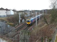 First TransPennine unit 185128 rounds the curve from Carstairs East Junction to join the WCML at Carstairs South Junction on 5 December 2011. The train is the 12.08 Edinburgh Waverley - Manchester Airport.<br><br>[Ken Browne 05/02/2011]