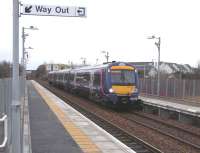 170 459 calls at Gartcosh en route from Glasgow to Falkirk Grahamston on 5 February. In the background, on the other side of the M73, is the village of Gartcosh. The traffic noise (which doesn't seem too bad to me) is presumably the reason why it was thought necessary to install 16 PA speakers.Behind the camera to the right is the brownfield site of the former steelworks which has been on the cusp of development for some years, while to the left all is rural with, on that day, a 'country smell' strong enough to stop a train.<br><br>[David Panton 05/02/2011]