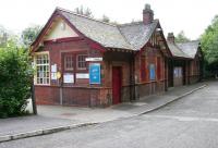A gem on the south side of Glasgow. Opened by the Lanarkshire and Ayrshire Railway in 1903, the station at Whitecraigs was originally (and unofficially) described in timetables of the day as the evocative <I>Whitecraigs for Rouken Glen</I>. Now served by electric services on the Neilston line the station approach (west side) is seen here in July 2005.<br><br>[John Furnevel 03/07/2005]