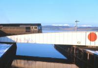 No, not the land of the Rising Sun, just Clachnaharry. The distant Ben Wyvis is coated in early snow as D5344 edges across the Caledonian Canal swing bridge on a crisp autumn afternoon in 1966.<br><br>[Frank Spaven Collection (Courtesy David Spaven) //1966]