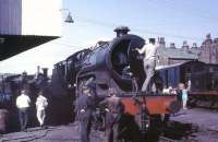 The first <I>Horwich Crab</I> 2-6-0, 42700, has recently been cosmetically restored in LMS Maroon livery as LMS No. 13000 and placed on display at NRM Shildon. For many years the loco was a 26D Bury engine and it is seen here only three years after withdrawal, at a KWVR open day in Haworth yard. Also on display in the picture are MSC 0-6-0T No. 31, another industrial loco, LMS 1F 0-6-0T 41708 and GNR N2 0-6-2T 69523. <br><br>[David Hindle //1969]