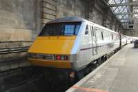 91107 in its new East Coast silver livery (but still with GNER blue skirts) stands at Platform 1 of Glasgow Central on 10 February, being readied for the return to London Kings Cross. This is a service that will become much rarer after the May 2011 <I>Eureka!</I> timetable comes into effect, being cut back from the present six a day to a single daily service.<br><br>[Graham Morgan 10/02/2011]