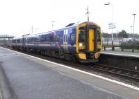 For most of the day every other service on the Glasgow-Cumbernauld line is extended to Falkirk Grahamston. Although the longer services will naturally carry more passengers to and from Glasgow two and three coach sets seem to be used indiscriminately on either working. Here 158 727 is seen with a service from Grahamston to Queen Street on 5 February.<br>
<br><br>[David Panton 05/02/2011]