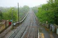 View east across the valley of the River Eden over the 5-arch Wetheral Viaduct on the Newcastle and Carlisle line. The photograph was taken from the footbridge at Wetheral station during fine, misty, Cumbrian rain on 12 May 2006. Note the footway running along the north side of the viaduct which provides a pedestrian link with the village of Great Corby just across the valley [see image 32217].<br>
<br><br>[John Furnevel 12/05/2006]