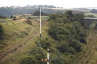 Just beyond Prospect Hill Junction, with Whitby West Cliff station behind the camera, looking south on 21 August 1971. [See image 32465]. On the left the line to Scarborough heads out onto Larpool Viaduct in the background. On the right the line to Whitby Town curves down towards Bog Hall Junction, passing below the viaduct before running along the north shore of the Esk to reach Town station.<br><br>[Bill Jamieson 21/08/1971]