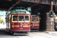 Two City Circle W-class trams pass in Flinders Street on 7 October 2008. This free service for tourists also attracts the locals. The bridge carries the railway lines linking Flinders Street Station to Spencer Street, now called Southern Cross.<br>
<br><br>[Colin Miller 07/10/2008]