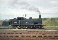 Class N15 0-6-2T no 69186 on duty in the yard at Leith South on 30 September 1958. View north towards the Forth with the Caledonian embankment running across the background.<br><br>[A Snapper (Courtesy Bruce McCartney) 30/09/1958]