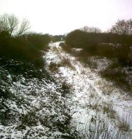 On a snowy 27 December 2010 the dormant station at Swanbourne, West of Bletchley (the platform is just visible on the curve) seems to be waiting patiently for a train to call. Might only be another four years or so.<br><br>[Ken Strachan 27/12/2010]