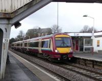 170 477 pulls into Cumbernauld with a terminating service from Glasgow Queen Street on 5 February. The building in the background looks a little out of place when seen in the flesh: all on it's own and the oldest building as far as the eye can see. That's because it was part of the hamlet called Cumbernauld Station which was the only nearby settlement until the New Town filled in the considerable gap between the station and Cumbernauld village proper [see image 32482].<br>
<br><br>[David Panton 05/02/2011]