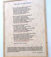 <I>The Boy in the Train</I>. A 6ft tall work at Kirkcaldy station with each letter cut from, and inlaid in, the linoleum for which the town is famed. It is written in no dialect that I recognise. I've never heard anyone pronounce Kirkcaldy 'Kirkcaddy', which funnily enough is easier to find suitable rhymes for than the correct pronunciation. Harbour 'mou' '? Right, I'll shut up. Photographed on 12 February 2011. <br>
<br><br>[David Panton 12/02/2011]