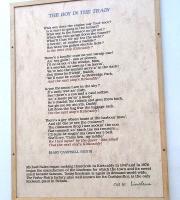 <I>The Boy in the Train</I>. A 6ft tall work at Kirkcaldy station with each letter cut from, and inlaid in, the linoleum for which the town is famed. It is written in no dialect that I recognise. I've never heard anyone pronounce Kirkcaldy 'Kirkcaddy', which funnily enough is easier to find suitable rhymes for than the correct pronunciation. Harbour 'mou' '? Right, I'll shut up. Photographed on 12 February 2011. <br>
<br><br>[David Panton 12/02/2011]