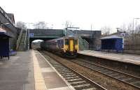 On the route of the Liverpool and Manchester Railway, a Northern <br>
service between those cities heads east non stop through Eccles station on 19 February 2011. The Class 156 unit travels a little faster than Stephenson's Rocket and the other locomotives of that era. The station is kept in a very tidy condition by FRECCLES (Friends of Eccles Station). In addition to the flower beds on both platforms they have also provided several excellent posters explaining the history of the station from 1830 up to the fire that resulted in its destruction in 1971. To the right of the fence there is one other track where once there were two (each with its own platform). Today this is a loop line used by freights and occasional steam specials when they need to stop for water.<br>
<br><br>[John McIntyre 19/02/2011]