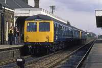 A pair of smartly turned out Class 105 DMUs full of enthusiasts has just arrived at Wymondham on 11th October 1980. The train is about to reverse and head off up the goods only branch to Dereham and Ryburgh.<br><br>[Mark Dufton 11/10/1980]