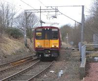 On 5 February 2011 unit 314 205 pulls out of the reversing stub at Neilston heading for the departure platform to form the next service to Glasgow Central. The following half-hourly terminating service will occupy the stub in a few minutes time, so it's occupied for most of the day.  Note the increasingly old-fashioned destination blind still carried by all 314s.<br>
<br><br>[David Panton 05/02/2011]