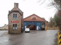 The old tram depot on the Isle of Bute, now I believe a listed building, housed 20 electric tramcars before the tramway closed in 1936 and is still used to this day to garage the island's buses. The depot is presently operated by West Coast Motors Ltd, some of whose fleet can be seen in this picture taken from the depot entrance alongside the main road to Rothesay on 28 December 2010. [See image 32285]<br><br>[Mark Bartlett 28/12/2010]