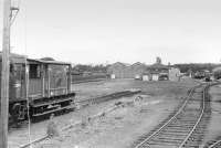 The former wagon shops at Ladybank photographed from a Dundee-bound train in 1973, with the Newburgh / Perth line passing to the left.D3540 is standing by awaiting her next duty shunting the extensive engineers sidings.<br><br>[Bill Roberton //1973]