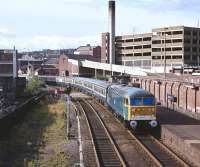 The <I>Melton Mowbray Pieman</I> runs north ecs into Barnsley station behind 56008 on the morning of Sunday 24 July 1977. The special, organised by BR Eastern Region, departed for Melton Mowbray at 09.00, arriving there just before lunchtime. Lunch on this occasion was provided at no extra cost by BR, who supplied each participant on arrival with... you've guessed it...  a Melton Mowbray pork pie.<br>
<br><br>[Bill Jamieson 24/07/1977]