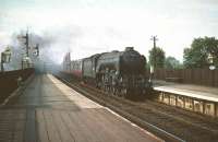 The unique A3 with full size smoke deflectors no 60097 <I>Humorist</I> leaves the Forth Bridge in August 1959 and runs south through Dalmeny heading for Waverley.  <br><br>[A Snapper (Courtesy Bruce McCartney) 08/08/1959]