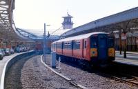 An arrival from Glasgow Central stands at platform 2 of Wemyss Bay station on 7th April 1988. The recently lifted road into platform 3 can be seen on the left.<br>
<br><br>[Colin Miller 07/04/1988]