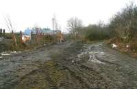 View south along the Glencorse branch on 21 February with the bridge carrying the Edinburgh City Bypass behind the camera [see image 32891]. On the left the 'main line' continued south past what is now Edgefield industrial estate towards Loanhead station and the site of the former Ramsay and later Bilston Glen Collieries. A mineral line on the right ran past Straiton Sidings (now a nature reserve) and on to provide links to the once thriving shale and limestone operations in the area, including oil works at Pentland and Straiton (the latter now a large retail park) and lime works at Burdiehouse.<br>
<br><br>[John Furnevel 21/02/2011]