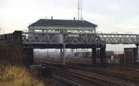 The signal box at Portobello East was a distinctive structure, spanning the ECML on the Edinburgh side of the junction with <br>
the Waverley Route (behind the photographer) and the branch to LeithSouth (visible immediately above the '20' speed restriction sign). Seen here late in the afternoon of Sunday 22nd November 1970.<br><br>[Bill Jamieson 22/11/1970]