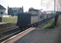 St Margarets J37 0-6-0 no 64562 about to run tender first through Joppa station with a coal train on a fine July day in 1959. The train is passing a DMU that has just left the eastbound platform.<br><br>[A Snapper (Courtesy Bruce McCartney) 25/07/1959]