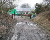 The trackbed of the mineral line running south from Straiton Sidings on the Glencorse branch [see image 32922] now ends at the site of the level crossing over the B702 that once gave access to Straiton Oil Works. The oil works site is today occupied by a large retail park - which includes the inevitable McDonalds. View south on 21 February 2011.<br>
<br><br>[John Furnevel 21/02/2011]