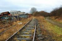 View to compare with the more recent shot [see image 32922]. There was a short siding (new in 1878) to the left of the line seen here and former cabin which stood to the left. This may have been for 'cripples'. Off to the right of the Straiton Branch exchange sidings was a rail served tip, accessed from the branch. At the time of the photograph the track a short distance behind the camera and up to the City Bypass overbridge was lifted.<br><br>[Ewan Crawford 23/12/2004]