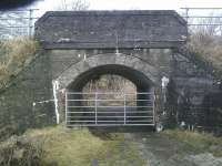 It wasn't just the Mallaig Extension that used concrete for its major structures as this bridge that carried the Ballachulish branch near Appin shows. The concrete arch has been decorated to simulate stonework and the trackbed here and in nearby Appin station can be walked or cycled. [See image 29772] for a picture of the station itself and the surviving (concrete) platforms. <br><br>[Malcolm Chattwood 26/02/2011]