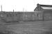 Bothy, tool store, covered bike shed, office, training room, toilet facility etc.. at one time the highly adaptable 'grounded coach' was a feature of virtually every steam shed. This one (complete with padlock) was located near the south end of the coaling stage at Ferryhill in 1973. Class 40 no 264 can just be seen in the left background.<br><br>[John McIntyre /01/1973]