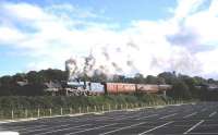 The RPSI operated former GNRI 4-4-0 no 85 <I>Merlin</I> photographed heading west from Lisburn station, Northern Ireland, with a railtour in October 1987. The rolling stock for the tour has also come from the RPSI base at Whitehead, County Antrim.<br>
<br><br>[John McIntyre /10/1987]