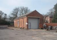 The former engine shed at Whittingham Hospital, which became a workshop after the railway closed in 1957. A goods line to the boiler house continued from this yard past the shed and skirted the ornamental pond as it passed through the gardens. Although this area of the site is still in NHS use most of what was once the largest asylum in the country closed in 1995 and is now derelict and awaiting clearing for residential development. [See image 33240] for the same view taken around 1950. Photo taken with kind permission of NHS staff.<br><br>[Mark Bartlett 03/03/2011]