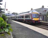 A toddler's-eye view from behind the elephant's ears (Bergenia) as 170 473 comes to a stop at Aberdour on 5 March. This service is for <br>
Glenrothes: going the 'wrong' way due to engineering diversions on the weekend closure of the Forth Bridge line.<br>
<br><br>[David Panton 05/03/2011]