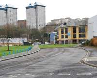 The remains of the branch to Victoria Harbour running east along Greenock's truncated Arthur Street in March 2011. After passing under the distant arch the line ran parallel to the main line (where there was a yard) before joining it. In the East India Harbour this line was joined by another branch, approached by reversal, from Greenock Central.<br><br>[Ewan Crawford 05/03/2011]