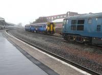 Class 156 no 156506 with the 09.18 service to Carlisle about to pass class 31 no 31106 with a track measurement train at Kilmarnock on 4 March 2011.<br><br>[Ken Browne 04/03/2011]