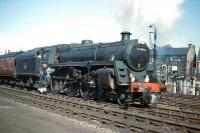 Eastfield-based Standard Class 5 4-6-0 No. 73105 powers Glasgow holiday stock through Gorgie East station on the Edinburgh sub on 3rd April 1961.<br><br>[Frank Spaven Collection (Courtesy David Spaven) 03/04/1961]