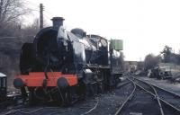 Maunsell Ex-SR N Class mogul no. 31874 almost 20 years after it was <br>
withdrawn by BR (May 1964) is seen on shed at Ropley on the Mid <br>
Hants Railway in December 1983. Inside the smokebox one of the volunteers is getting rather dirty cleaning the tubes.<br>
<br><br>[John McIntyre /12/1983]