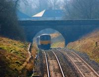 A late running Clitheroe - Manchester Victoria service is seen <br>
just south of Ramsgreave & Wilpshire station. Having completed the climb over the summit it is now on the downhill section to Daisyfield Junction and its next sheduled stop at Blackburn.<br><br>[John McIntyre 01/03/2011]