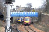 170s off the north end of Kirkcaldy station, one in the siding and the other on the Up line, on Sunday 6 March. The siding is not normally used on a Sunday as there are no terminating trains, but a special timetable was in place for engineering work diversions. Note the painting of Bennochy Road overbridge. There was a fad in the 1980s for painting such bridges with geometric shapes. To today's eyes it has the effect of drawing attention to something humdrum without making it attractive. How tastes change.<br><br>[David Panton 06/03/2011]