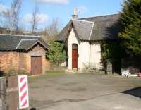 The buildings around Loanhead station, now a private residence, seen from the entrance on Station Road on 28 February 2011. The date above the door to the station house is 1874. The buildings on the other side of the trackbed which can be seen above the roof of the old booking office were part of the former Ramsay Colliery [see image 24338].<br><br>[John Furnevel 28/02/2011]