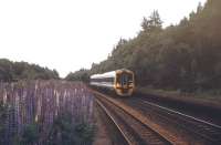 A 158 bound for Inverness heads north through the abandoned platforms of Tomatin station in July 1991.<br><br>[Ian Dinmore /07/1991]