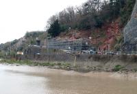 Scaffolding surrounding an old railway tunnel in Bristol on the former branch from Sneyd Park Junction to Hotwells terminus located near the Clifton Suspension Bridge. The line was closed in 1922 and lifted shortly thereafter with the tunnel being put to other uses, not least as an air raid shelter during World War 2. The tunnel is now partially collapsed causing concerns regarding the stability of the cliff face and work is seen here in progress on 11 March in an effort to remedy the problem.<br>
<br><br>[Peter Todd 11/03/2011]