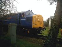 I'm sure that tree wasn't there when I got here.. the driver of 37219 shows a lot of patience as he waits for the crossing gates to be opened so that he can pick up some track panels, leaving 47.580 to haul the 16.15 back to Dereham. The MNR's locos are very well turned out.<br><br>[Ken Strachan 05/03/2011]