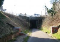 View south west along the route of the EL&RR on 28 February showing the trackbed passing below the crossroads in the centre of Loanhead on its way towards Roslin. Loanhead station is 100m behind the camera. Top left on Station Road stands 'Man boy and Horse', a work by local sculptor Alan Herriot featuring a coal miner, a boy and a pit pony. The closure of Bilston Glen Colliery in 1989 brought to an end a long history of mining in the area.<br>
<br><br>[John Furnevel 28/02/2011]