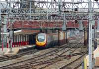 Looking south through the station from Crewe North signal box on 12 March 2011 as a London Euston - Manchester Piccadilly Pendolino service calls at Platform 5.<br><br>[John McIntyre 12/03/2011]