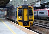 An Arriva Trains Wales service to Pembroke Dock (or, in Welsh, Doc <br>
Penfro as is displayed on the unit) departs from platform 6 at Crewe on 12 March 2011. Over on platform 5 is a London Euston - Manchester Piccadilly Pendolino and waiting patiently in the background for it to get out of the way is 350120 with a Liverpool Lime Street - Birmingham New Street service.<br><br>[John McIntyre 12/03/2011]