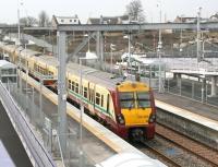 The 10.21 ex-Edinburgh Waverley calls at Armadale on 7 March, prior to continuing on its journey to Helensburgh Central. Work on the access roads and general infrastructure surrounding the new station continues.<br><br>[John Furnevel 07/03/2011]