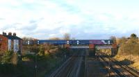 Looking north along the WCML towards Preston at Farington on 13 March 2011. A Blackpool to York service is heading east towards Lostock Hall in the hands of a hybrid 3-car Class 158 unit.<br>
<br><br>[John McIntyre 13/03/2011]